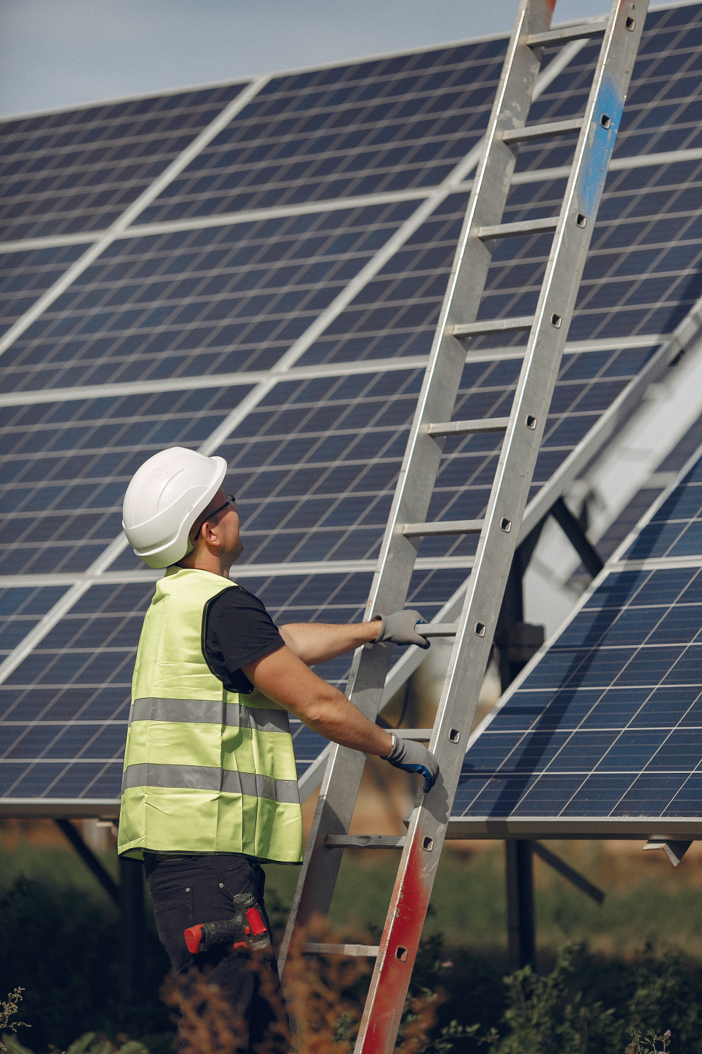 man-with-white-helmet-near-a-solar-panel-1.jpg